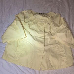 Light yellow button up. Casual.